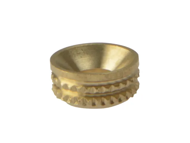 Brass ring with textured design on a white background