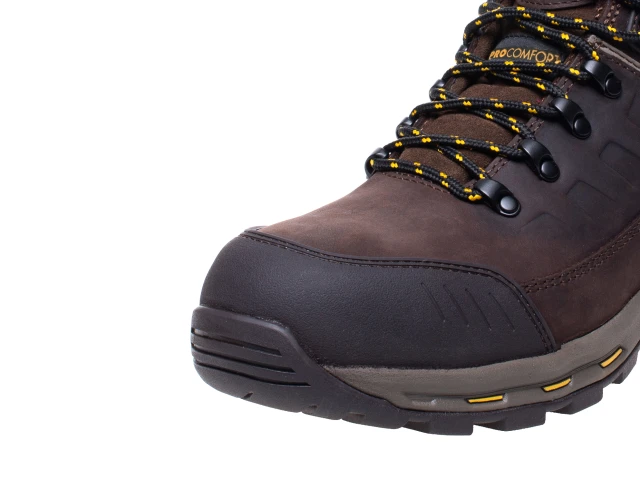 Brown hiking boot with black sole on a white background