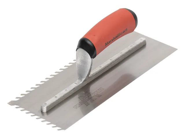 Metal trowel with red handle on a white background