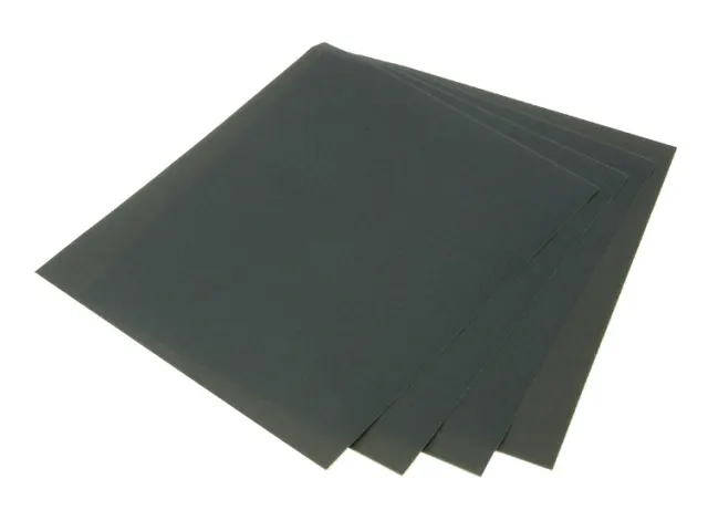 Three black sheets of paper on a white background