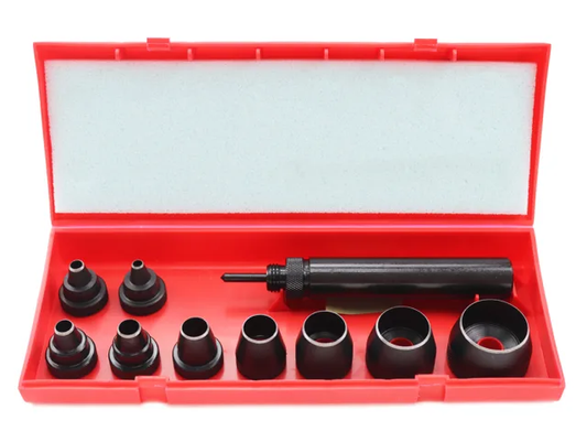 Set of black metal tools in a red tool box on a white background