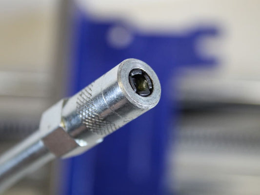 Close-up of a metal tool with a blurred background