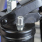 Close-up of a mechanical component with a black housing and metal fitting.