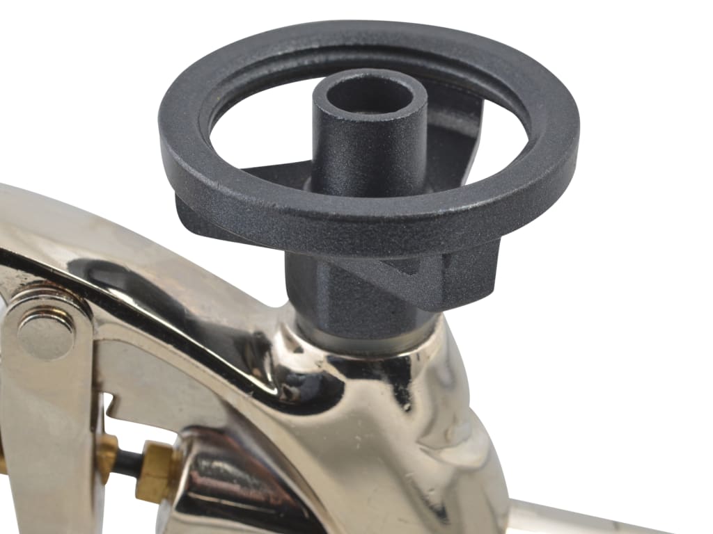 Close-up of a metallic valve handle with a black wheel on a white background