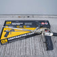Contractor foam gun with packaging on a textured surface
