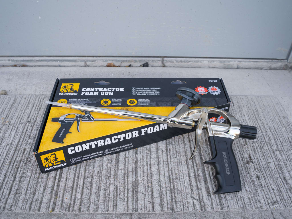 Contractor foam gun with packaging on a textured surface