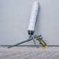 Foam gun with a foam cartridge on a gray background