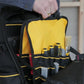 Person holding a yellow and black tool bag with tools inside.