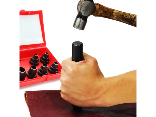 Hand holding a black tool next to a red tool set with sockets and a hammer on a white background