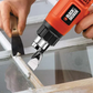 Person using a Black & Decker tool to work on a window frame.