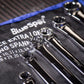 Set of ring spanners on a BlueSpot branded tool roll.