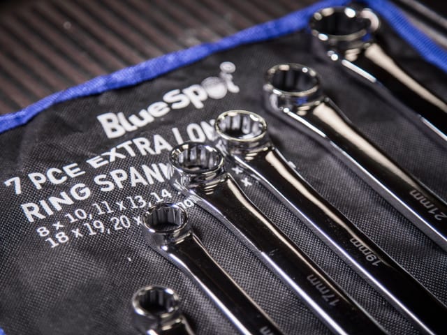 Set of ring spanners on a BlueSpot branded tool roll.