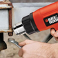 Person using a Black & Decker drill on a metal surface