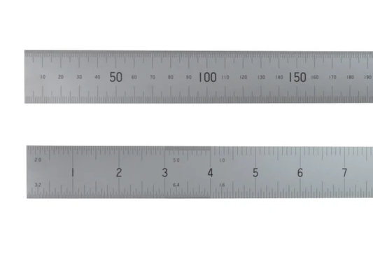 Two metal rulers on a white background