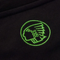 Green embroidered logo on a black fabric background