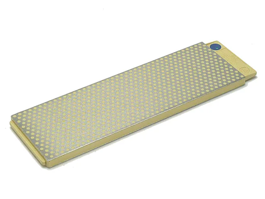 Rectangular stone with diamond pattern on a white background