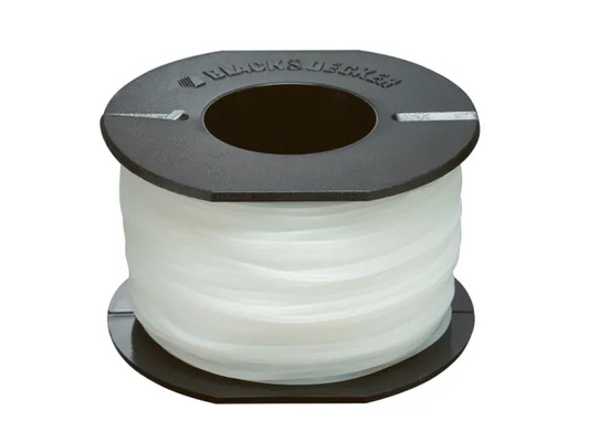 Spool of white ribbon with a black top on a white background