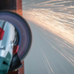Angle grinder in action with sparks flying