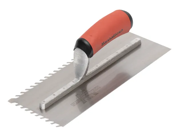 Notched trowel with red and black handle on a white background