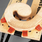 Wooden dowel with a circular hole on a wooden block with measurement markings.