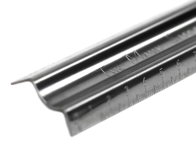 Metal edge trim with measurement markings on a white background