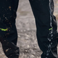 Black pants with visible branding on a textured ground