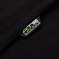 Close-up of a black fabric with a logo label on a dark background