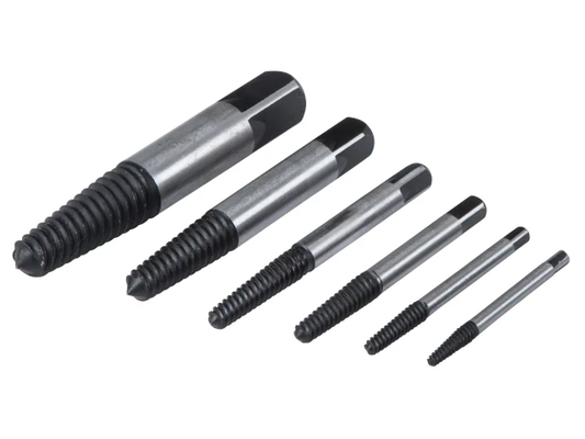 Set of metal threading tools on a white background