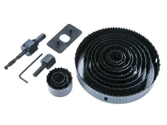 Set of black metal components including a large gear, smaller gears, and tools on a white background