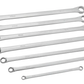 Set of six metallic wrenches on a white background