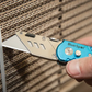 Person using a Blue Spot brand utility knife on cardboard