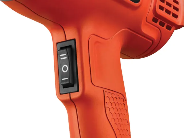 Close-up of a red power tool handle with a switch on a white background