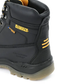 Black work boot with yellow accents on a white background