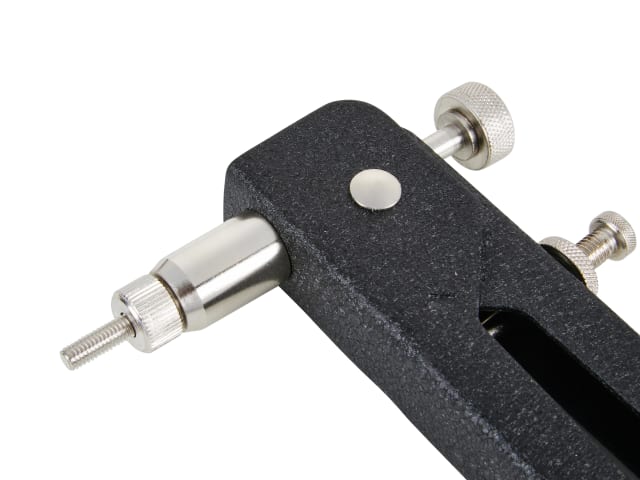 Close-up of a mechanical tool with black handle and silver components on a white background