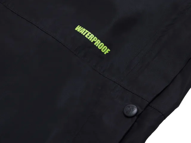 Black jacket with 'WATERPROOF' text on a dark background