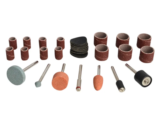 Assorted sanding drums and grinding stones on a white background