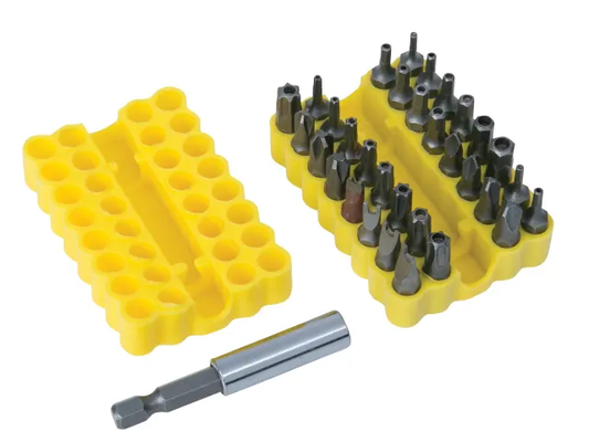 Set of drill bits in a yellow holder with a spare bit on a white background