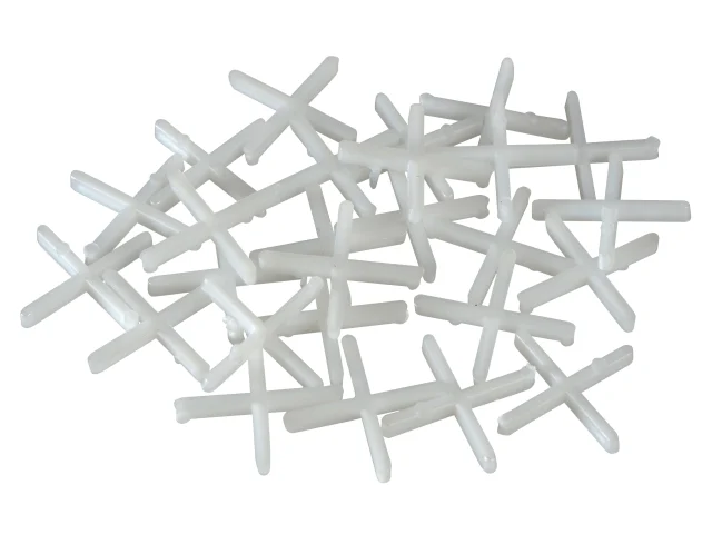 White plastic crosses on a white background
