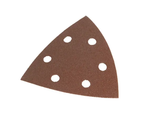 Triangular sandpaper with holes on a white background