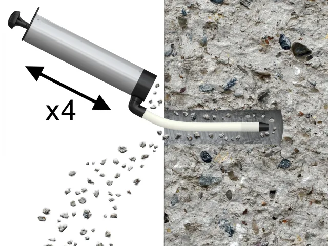 Concrete mixing tool with gravel on a textured concrete surface