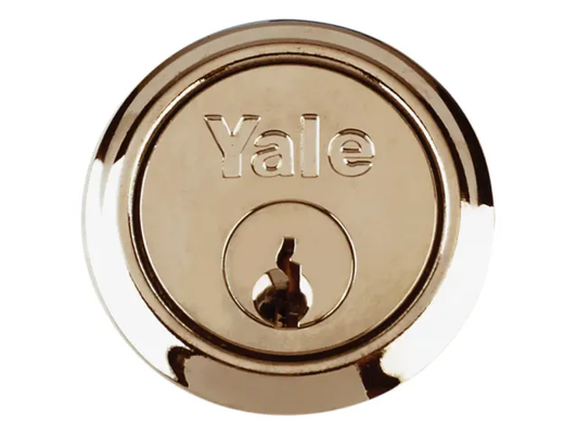 Gold Yale lock on a white background