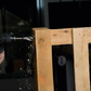 Drilling into a wooden pallet with a power drill