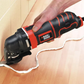 Black and Decker oscillating tool being used to cut a piece of wood.
