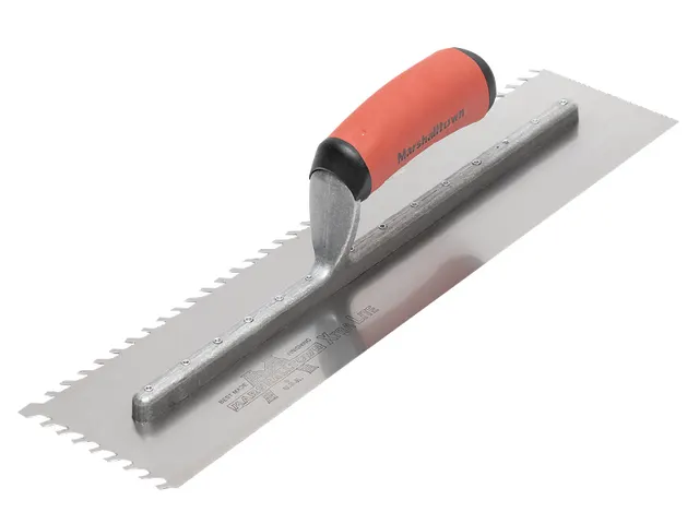 Metal trowel with a red and black handle on a white background